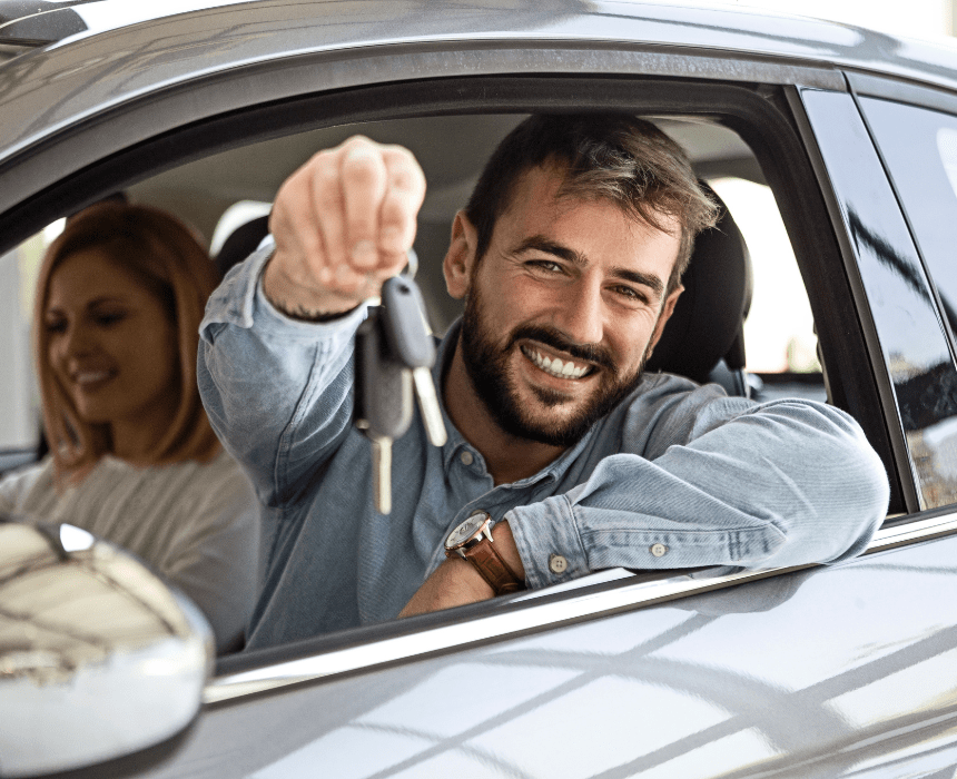 guy with his key happy for getting his license desktop